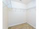 Walk-in closet featuring carpet flooring, neutral paint, and wire shelving for ample storage at 162 Limerick Rd # C, Mooresville, NC 28115