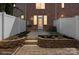 Back patio with brick accents, garden area, and exterior door at 164 Singleton Rd, Mooresville, NC 28117