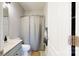 Bathroom with shower featuring a grey shower curtain and white cabinet at 164 Singleton Rd, Mooresville, NC 28117