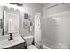 Bathroom featuring grey cabinets and a shower with black and white curtains at 164 Singleton Rd, Mooresville, NC 28117