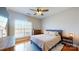 Bedroom featuring a large window, hardwood floors, ceiling fan, and neutral paint at 164 Singleton Rd, Mooresville, NC 28117