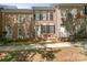 Beautiful brick townhome with black shutters, well maintained landscaping, and inviting entrance at 164 Singleton Rd, Mooresville, NC 28117