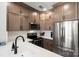 Kitchen featuring stainless steel appliances, wooden cabinets, quartz countertops and undermount sink at 164 Singleton Rd, Mooresville, NC 28117