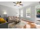Bright living room with hardwood floors, neutral walls, and ample natural light from large windows at 164 Singleton Rd, Mooresville, NC 28117