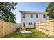 A level backyard features a privacy fence and small patio for outdoor enjoyment at 2003 Ashley Rd # B, Charlotte, NC 28208