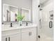Gorgeous bathroom featuring double sinks, modern fixtures, and a glass-enclosed shower at 2003 Ashley Rd # B, Charlotte, NC 28208