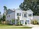 Charming two-story home with dual garage, manicured lawn, and window boxes at 2003 Ashley Rd # B, Charlotte, NC 28208