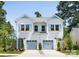 Charming two-story duplex with light blue shutters, flower boxes, and well-maintained landscaping at 2003 Ashley Rd # B, Charlotte, NC 28208
