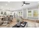 Light-filled living room with a modern color palette, a dining area, and an open-concept kitchen at 2003 Ashley Rd # B, Charlotte, NC 28208
