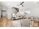 Inviting living room showcasing natural light, hardwood flooring, and a staircase leading to the upper level at 2003 Ashley Rd # B, Charlotte, NC 28208