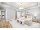 Beautiful main bedroom suite boasts tray ceiling, calming colors, and hardwood flooring at 2003 Ashley Rd # B, Charlotte, NC 28208