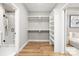 Large walk-in closet with custom shelving and ample space for storage at 2003 Ashley Rd # B, Charlotte, NC 28208