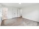 A bright bedroom shows a full bathroom and large closet at 2416 Wendy Ln # 13, Gastonia, NC 28052