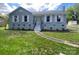 Inviting one-story home featuring a classic design and a neatly maintained lawn, blending comfort and curb appeal at 2416 Wendy Ln # 13, Gastonia, NC 28052