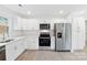 Spotless kitchen featuring stainless steel appliances and white cabinets, blending style and functionality at 2416 Wendy Ln # 13, Gastonia, NC 28052