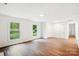 Spacious living room with hardwood floors, a door to the hall, and lots of light for easy living at 2416 Wendy Ln # 13, Gastonia, NC 28052