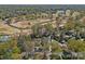 Aerial view of home surrounded by lush landscaping and a golf course at 2637 Normandy Rd, Charlotte, NC 28209