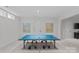 Spacious basement game room featuring neutral walls and floors, as well as a ping pong table at 2637 Normandy Rd, Charlotte, NC 28209
