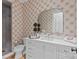 Elegant bathroom boasts a white vanity, modern fixtures, stylish mirror, and tiled shower at 2637 Normandy Rd, Charlotte, NC 28209