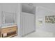 Bathroom featuring a marble vanity and shower with natural light from the window at 2637 Normandy Rd, Charlotte, NC 28209