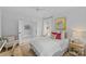 Bright bedroom with white walls and a comfortable bed and connected sitting room at 2637 Normandy Rd, Charlotte, NC 28209