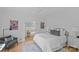 Bedroom with white bedding, area rug, and decor at 2637 Normandy Rd, Charlotte, NC 28209