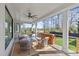 Covered outdoor deck featuring lounge seating with a ceiling fan and shade at 2637 Normandy Rd, Charlotte, NC 28209