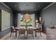 Elegant dining room with garden views, features stylish lighting and neutral finishes at 2637 Normandy Rd, Charlotte, NC 28209