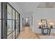 Inviting foyer features herringbone floors, modern lighting, and a stylish console table at 2637 Normandy Rd, Charlotte, NC 28209
