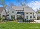 Stunning two-story home with manicured lawn, stone walkway, and modern curb appeal at 2637 Normandy Rd, Charlotte, NC 28209