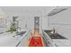 Bright, open kitchen features marble counters, a professional gas range, and stylish light fixtures at 2637 Normandy Rd, Charlotte, NC 28209