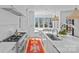 Well-appointed kitchen featuring premium appliances, an island with bar seating, and a breakfast nook at 2637 Normandy Rd, Charlotte, NC 28209