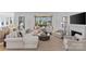 Comfortable living room featuring designer furnishings, a fireplace, and a window seat at 2637 Normandy Rd, Charlotte, NC 28209