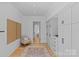 Serene sitting area with built-in storage, chair, and a view to the bedroom at 2637 Normandy Rd, Charlotte, NC 28209