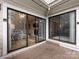 Spacious outdoor balcony with wood flooring and sliding glass doors leading to the living room at 2719 Selwyn Ave # 3, Charlotte, NC 28209