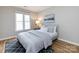 Bright bedroom features hardwood flooring and a cozy, relaxing feel at 2719 Selwyn Ave # 3, Charlotte, NC 28209