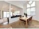 Open floor plan with a dining room table, chandelier, and a living room with a sofa at 2719 Selwyn Ave # 3, Charlotte, NC 28209