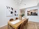 Dining room featuring a light wood table, six chairs, and art on the wall at 2719 Selwyn Ave # 3, Charlotte, NC 28209