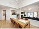 Open floor plan with a view from the dining room into the kitchen and living room with a fireplace at 2719 Selwyn Ave # 3, Charlotte, NC 28209