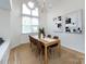 Dining room featuring a light wood table, six chairs, and art on the wall at 2719 Selwyn Ave # 3, Charlotte, NC 28209