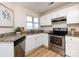 Bright kitchen featuring stainless steel appliances, granite countertops, and wood flooring at 2719 Selwyn Ave # 3, Charlotte, NC 28209