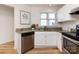 Well-lit kitchen features stainless steel appliances and granite countertops at 2719 Selwyn Ave # 3, Charlotte, NC 28209