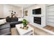 Spacious living room with large fireplace, open dining area, and lots of natural light at 2719 Selwyn Ave # 3, Charlotte, NC 28209