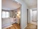 Serene main bedroom features wood floors and ensuite bathroom access at 2719 Selwyn Ave # 3, Charlotte, NC 28209