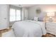 The primary bedroom boasts an ample amount of natural light, as well as wood look flooring at 2719 Selwyn Ave # 3, Charlotte, NC 28209