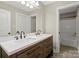 Modern bathroom featuring a double sink vanity with granite counter tops and a door to the toilet and tub at 2840 Wheatfield Ct, Lincolnton, NC 28092