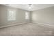 Bright, carpeted bedroom features a window for natural light and ample open space at 2840 Wheatfield Ct, Lincolnton, NC 28092