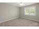 Bright, carpeted bedroom featuring a window for natural light and ample open space at 2840 Wheatfield Ct, Lincolnton, NC 28092