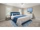 Cozy bedroom featuring a queen bed, bright windows, and simple decor for a relaxing atmosphere at 2840 Wheatfield Ct, Lincolnton, NC 28092