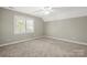 Neutral bedroom featuring plush carpet, a bright window, and space for personalization at 2840 Wheatfield Ct, Lincolnton, NC 28092